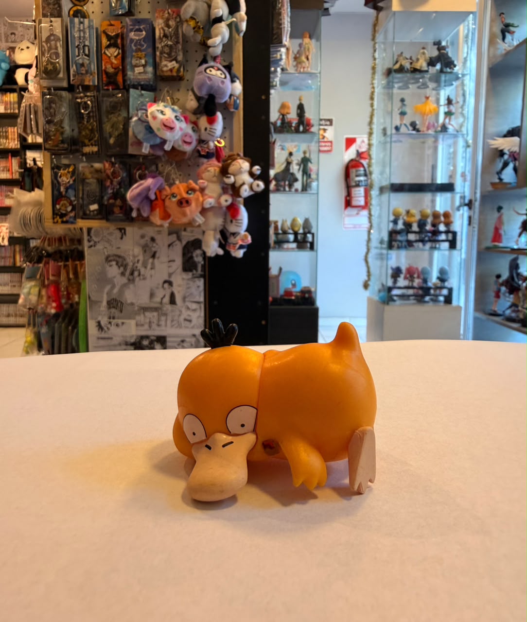 FIGURA GASHAPON DE PSYDUCK ACOSTADO